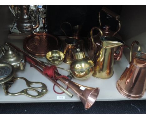 A selection of copper and brassware including hunting horn, trivet, Jersey can, jugs etc