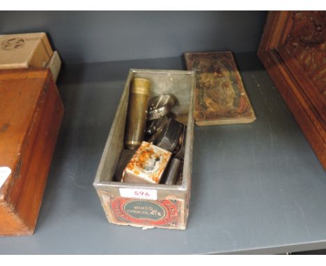 A tin of miscellaneous including coin locket, Empire 1869, Magic pocket lamp 1889, a brass telescope, Victorian ink pot etc