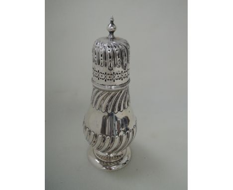 A Victorian silver caster of baluster form having gadrooned decoration to body and pierced decoration and finial to lid with 