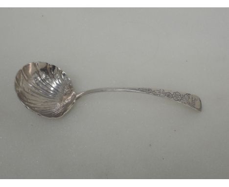 A Georgian Irish silver sauce ladle having scallop bowl and engraved handle, date mark worn, makers mark Michael Keating