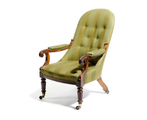 A William IV rosewood armchair, button upholstered with green striped fabric, on lappet carved front legs and brass castors, 