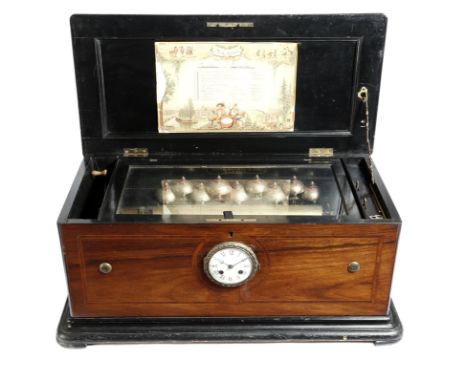 λ A large 19th century Swiss rosewood musical box with clock, the 14in brass cylinder playing ten airs with nine bells, with 