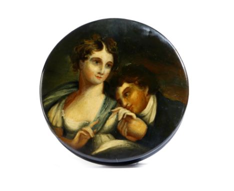 A 19th century lacquered papier-mâché snuff box, of circular form, the lid painted with lovers, the interior with traces of g