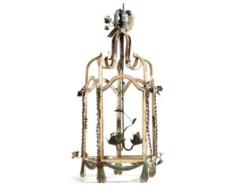 An early 19th century tôle peinte hall lantern, with three lights, the open scroll frame decorated with flowers and ribbons, 