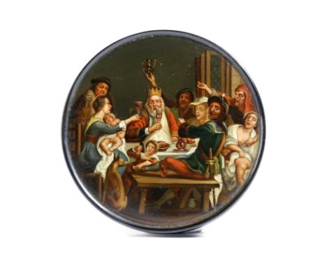 A 19th century German lacquered papier-mâché snuff box by Stobwasser, of circular form, the lid well painted with 'The Feast 