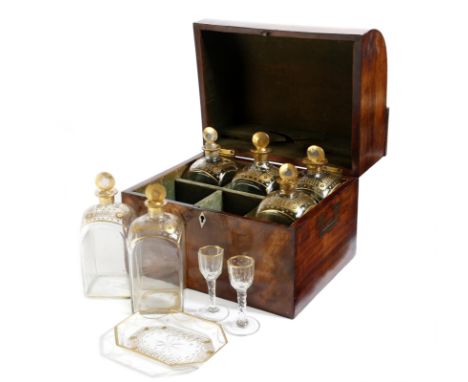 λ A mahogany spirit decanter box, with a sloping hinged front, revealing a divided plush lined interior with six gilt decorat