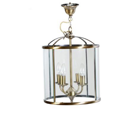 A circular brass and glass hall lantern, with a four-light fitting, together with a smaller similar example, 71.3cm high, 43.