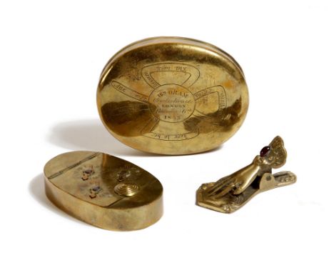 A 17th century brass oval snuff box, one side engraved with fleur-de-lis and inscribed 'Daniel Gilbert 1692', the other side 