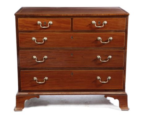 A late George III mahogany chest, the crossbanded top with satinwood banding, above two short and three long graduated drawer