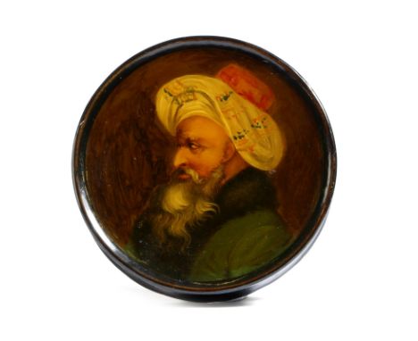 A 19th century German lacquered papier-mâché snuff box, of circular form, the lid painted with a portrait of a Turkish Pasha,
