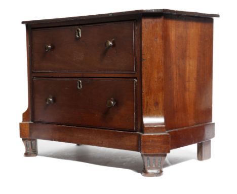 A 19th century Dutch mahogany miniature commode, of two drawers, on fluted front feet, the back with a branded mark 'Crown ov