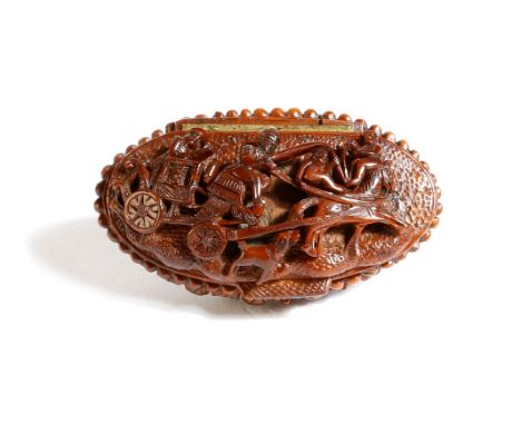 An early 19th century French carved coquilla nut snuff box, the hinged lid with a coach and horses, figures and a dog, the ba