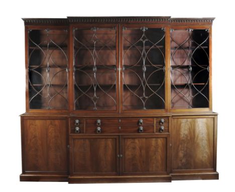 A George III and later mahogany secrétaire breakfront library bookcase, the detachable pendant cornice above astragal glazed 