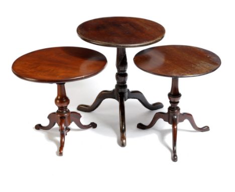 Three miniature mahogany tripod tables, each with a circular tilt-top, on a vase turned stem, possibly apprentice pieces, 18t