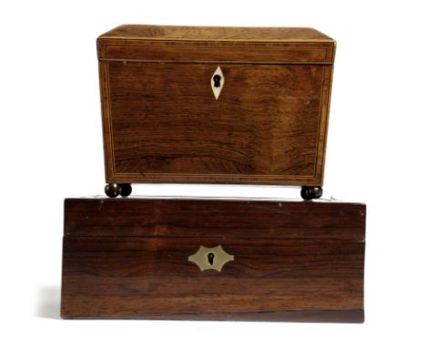 λ An early 19th century rosewood sarcophagus shape tea caddy, with kingwood banding, the interior with twin lidded compartmen