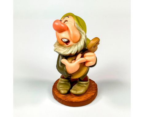 Ceramic in matte finish modeled as sneezy sneezing. Walt Disney Collection backstamp. This item has its original box. Box mea