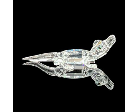 Part of the 'Endangered Species' group. Clear facetted body with pale-blue crystal eyes. Swarovski etched marking on the base