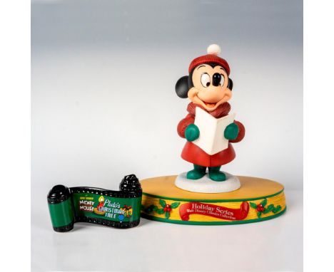 This figure depicts Minnie Mouse as a caroler from the Disney movie Pluto's Christmas Tree. Includes porcelain film roll sign