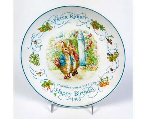 Collectors plate with an illustration of Mr. and Mrs. Rabbit with writing on surface and the year 1993.This item has its orig