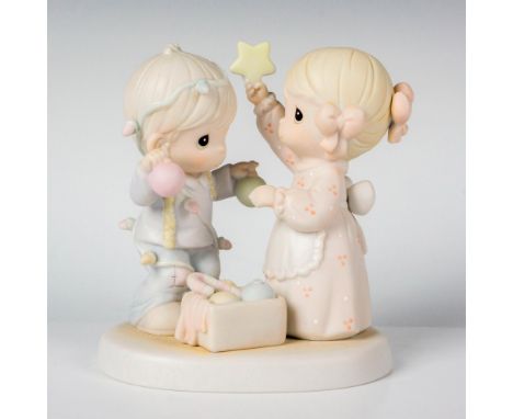 Features a young boy and girl playing with Christmas ornaments . Precious Moments backstamp. This item has its original box. 