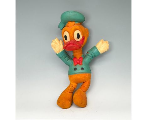 Early foam doll of Donald with Blue jacket and hat, red bow tie, white gloves. Bendy backstamp. Issued: c. 1930Dimensions: 7"