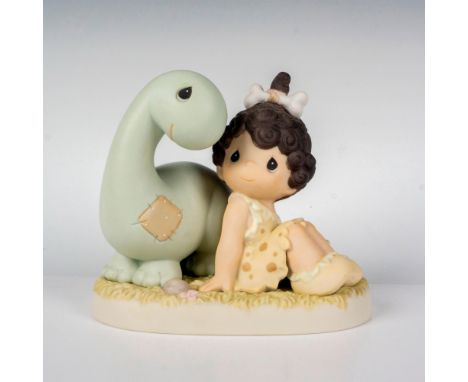 Featuring a little brunette cave girl and a dinosaur. Precious Moments backstamp. This item has its original box. Box measure