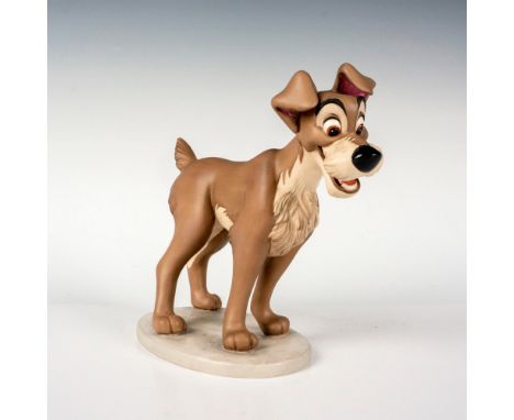Porcelain figure with matte finish. Depicts Tramp the stray mutt from the 1955 musical animated film, Lady and the Tramp. Wal