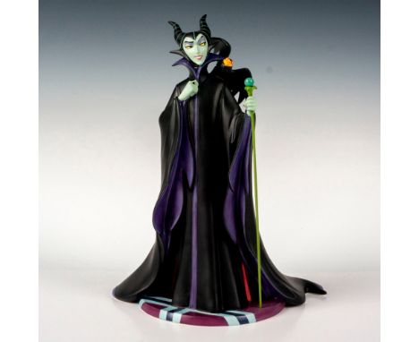 Ceramic in matte finish modeled as Maleficent holding her magic wand. Walt Disney Collection backstamp. This item has its ori
