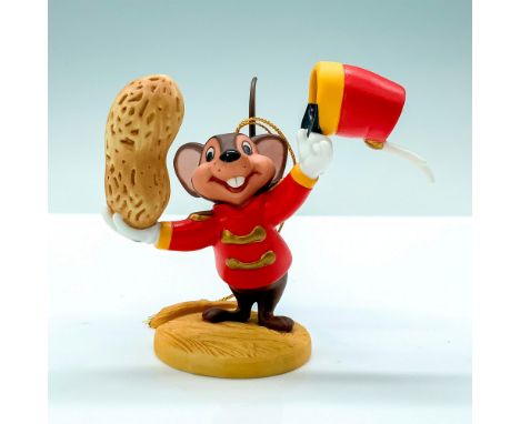 A porcelain ornament of Timothy Mouse from Disney's Dumbo holding a peanut in one hand and hat in another. Walt Disney Classi