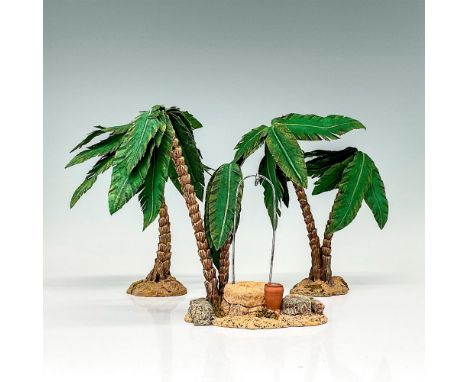 This figure is a set of three rocky landmasses with palm trees coming out of each. One of the figures has a water well in the