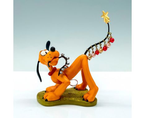 A porcelain ornament figure of Pluto from Disney's Pluto's Christmas Tree that depict Pluto wearing ornaments and a star on h