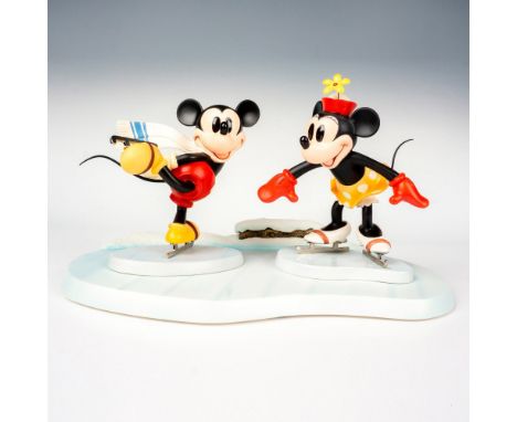 Collection of figurines including Mickey and Minnie on Ice Base, titled Watch Me. Walt Disney Collection marked on the base. 