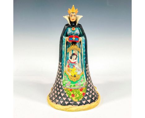 Wooden figure of Snow White characters, the evil queen and witch holding an apple. Detailed carving with cauldron and skull a