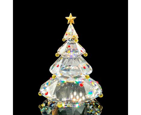This tree was in the Cheerful Times group. The tree is topped with a metal star, and has colored crystal ornaments on it. Swa