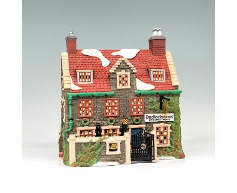 This figure depicts a quaint village building made of stone and brick. This item has its original box. The dimensions of the 