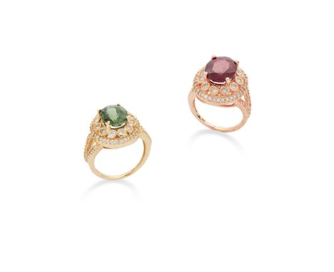 Two diamond and gem-set rings ring The oval-cut green tourmaline, to a brilliant-cut diamond surround and bifurcated shoulder