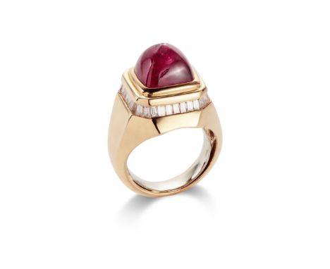 A ruby and diamond ring, by Adler The sugar-loaf cabochon ruby collet-set within a tiered surround accented with a line of ba