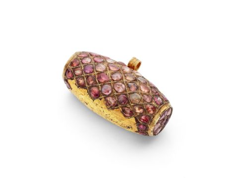 An Indian ruby-set amulet pendant, probably Assam, late 19th/early 20th century Of barrel form, kundan-set with pink foiled c