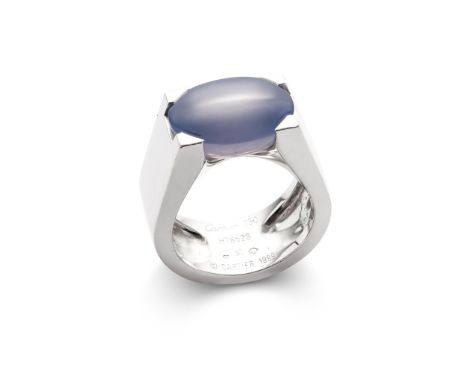 A chalcedony 'Tankissime' ring, by Cartier The oval-shaped blue chalcedony, to a wide polished 18ct white gold band, signed C