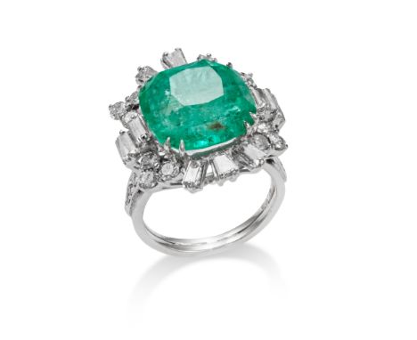 An emerald and diamond cluster ring The square cushion-shaped emerald, weighing 9.97 carats, raised within a brilliant and ba