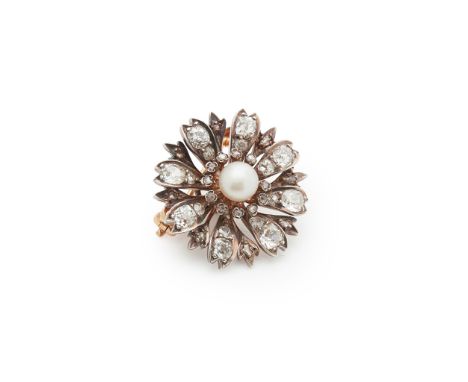 A French late 19th century pearl and diamond brooch Designed as a flower, centrally-set with a 6.15mm bouton-shaped pearl, wi