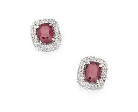 A pair of ruby and diamond earrings Each rectangular cushion-shaped ruby, within a two-row brilliant-cut diamond surround, po