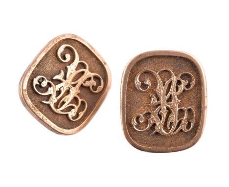 A pair of gold coloured rounded rectangular panels, unmarked, early 20th century, now with base metal swivel backs to form cu