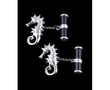 A pair of onyx and diamond seahorse cufflinks, the onyx baton with belcher links to a seahorse shaped panel, the eyes set wit