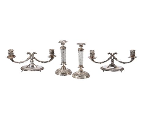 A pair of Italian silver coloured low twin light candelabra by Fernanda Mercatelli, Florence, 1944-68 .800 standard, the capi