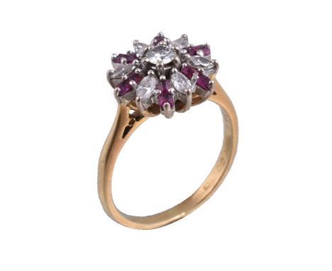 A 1960s 18 carat gold ruby and diamond cluster ring, the central brilliant cut diamond to radiating marquise cut diamonds, ap