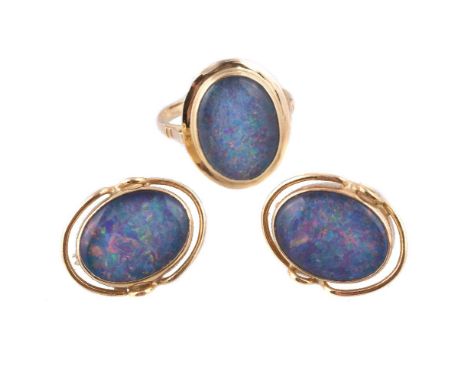 A opal triplet ring and earrings, the ring with an oval cabochon opal triplet within a polished surround, stamped 750 with ma