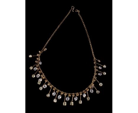 An Edwardian peridot and aquamarine fringe necklace, the oval cut aquamarines interspaced with vari cut aquamarines on knife 