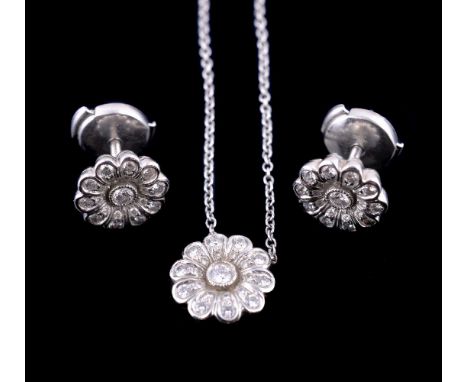 A pair of diamond flower head ear studs and pendant by Tiffany & Co., the earrings set with brilliant cut diamonds, signed T 