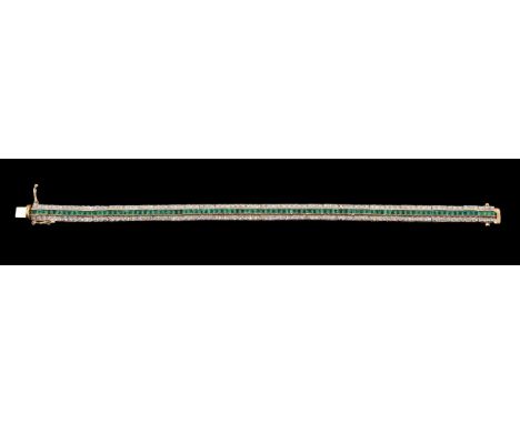 A diamond and emerald bracelet, the central row of step cut emeralds between two rows of brilliant cut diamonds, approximatel